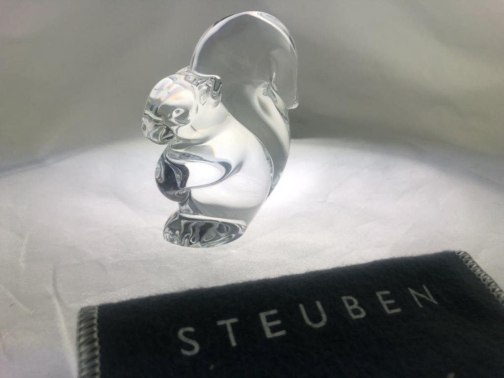Steuben Signed Crystal Squirrel #5537: Steuben Signed Crystal Intelligence Dolphin #5530 Hand Cooler Sculpture Figurine / Paperweight.. Possessing unique abilities to navigate the dolphin symbolized insight, intelligence and speed. 2.5" ta
