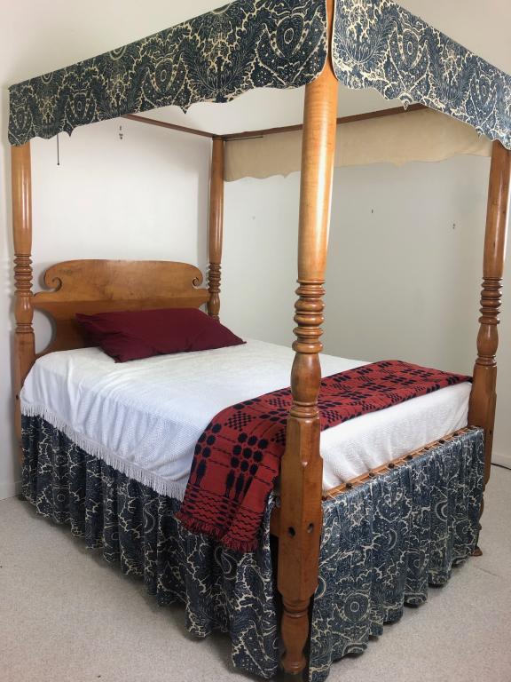 Antique Four Poster Maple Carved Canopy Full Bed: Wonderful Antique Four Poster Maple Carved Canopy Rope Bed (with custom Slates) & Scroll design headboard. With Mattress. Measures: 56" wide x 72" x 84" tall (Top 