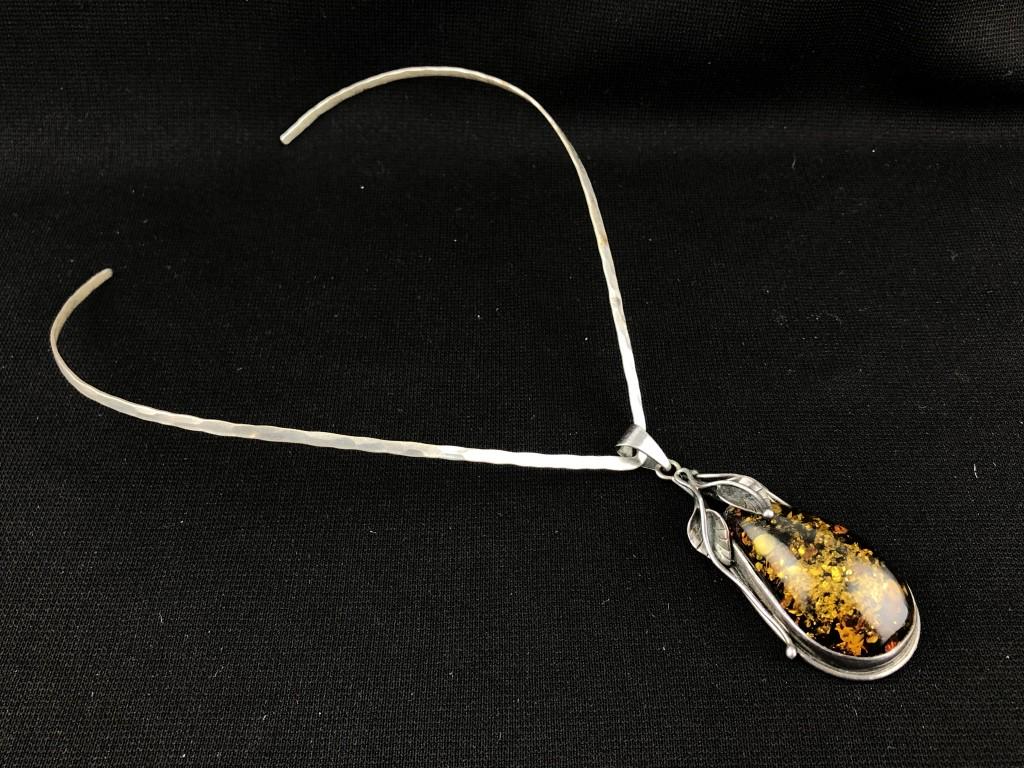 Stunning Sterling Amber Pendant on V Neck Collar: Handcrafted Vintage Amber Pendant in Sterling Silver on Sterling V Shape Hammered Neck Collar Necklace. Pendant w/ bail is 2-3/4" in length, amber is 1" wide. Wonderful Depth of Color. V Neck Collar i