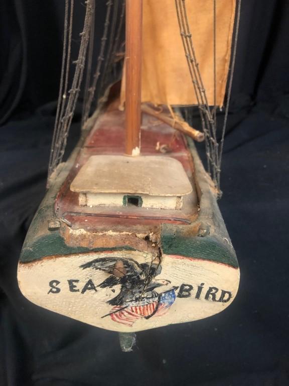 Antique Handcrafted 40" Wooden Model Sailing Ship: Hand-Craved antique 40" long Wooden Model Sailing Ship. 35" high x 7" beam. Name on Green & White Hull "Seabird". Sails needs TLC, Ladders and rigging in very good shape for age. Nice piece for any na