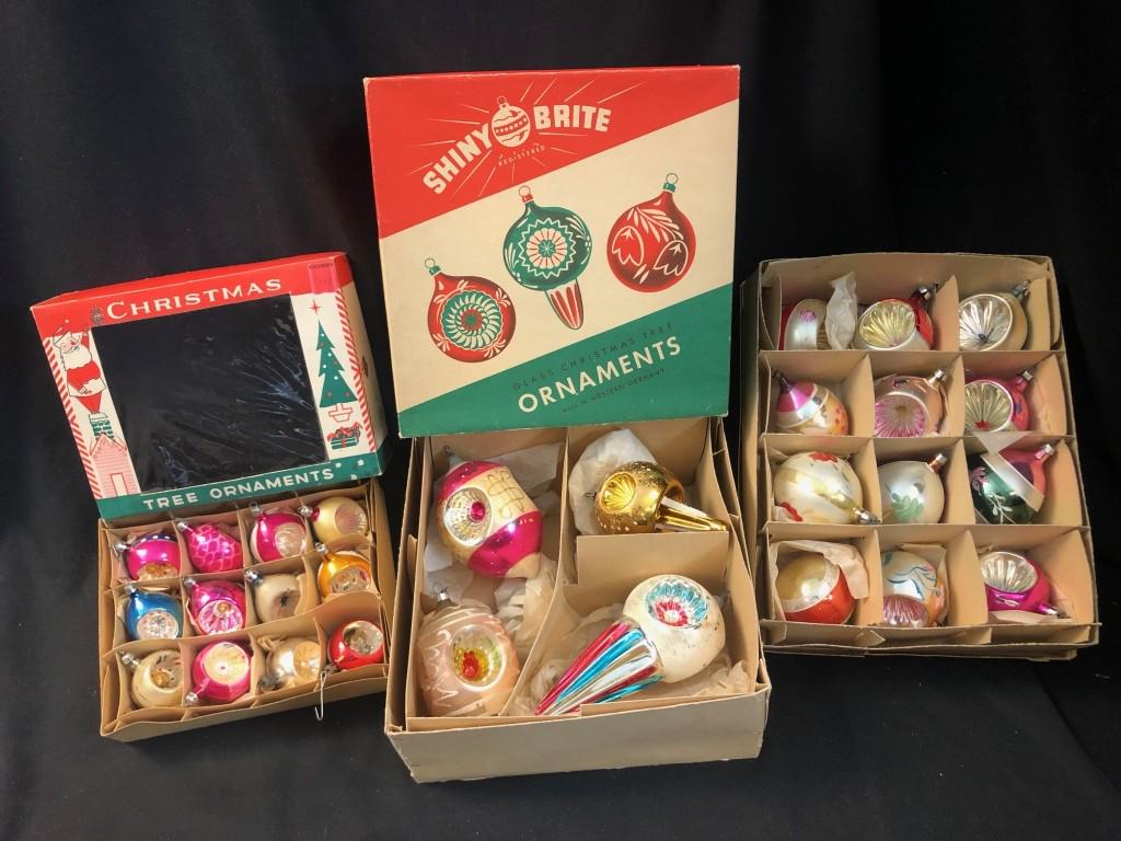 1940's Shiny Brites Indented Glass Xmas Ornaments: Lot of 28 Shiny Brites Indented Glass Christmas Ornaments. 4 Large ornaments made in Western Germany in original box, largest 7-1/2" long. Also Complete Box of 12 Made in Poland Glass Indented Ornamen