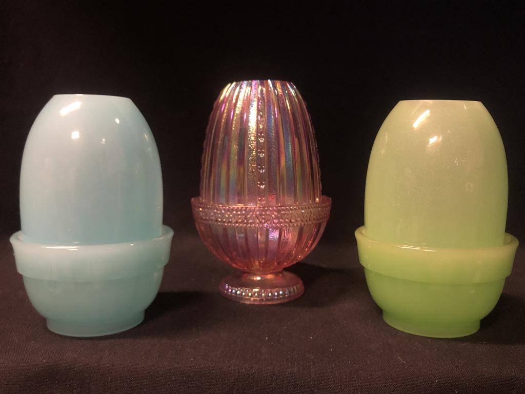 Group of 3 Frosted Fenton Fairy Lamp Lights: Set of three Fenton fairy lamps / fairy lights. Two frosted; one lime green, the other light blue smooth light, 4-3/4" tall. One iridescent pink ribbed carnival glass pedestal fairy lamp, 5-1/2" tall.