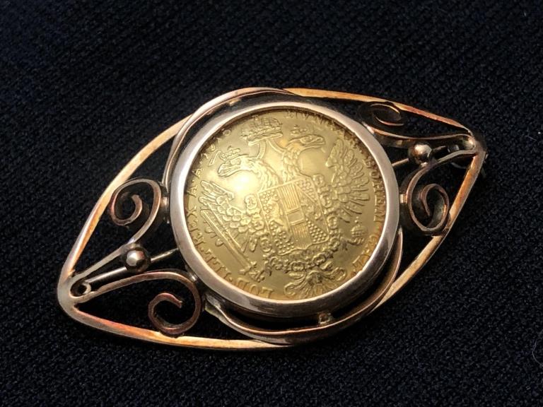 22K Gold Austrian Ducat Brooch in 14K Y Gold: High Carat 22 K Gold Coin Brooch in 14K Y Gold Setting. Coin is Austrian from 1915. The 1915 Austria Gold ducat was originally a “trade coin” issued for transactions between countries. The