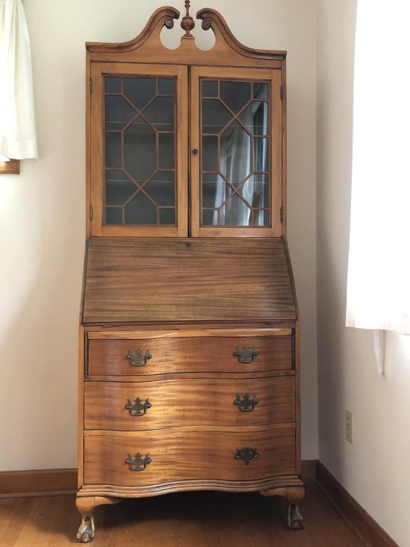 French Drop Down Secretary w/ Glass Panel Hutch: Antique French drop down secretary with hutch. Wonderful detailed glass paneled doors, warm wood with gorgeous distinct grain throughout, and handcarved finial. 3 Drawers + Drop Down Desk Cubbies. Mea