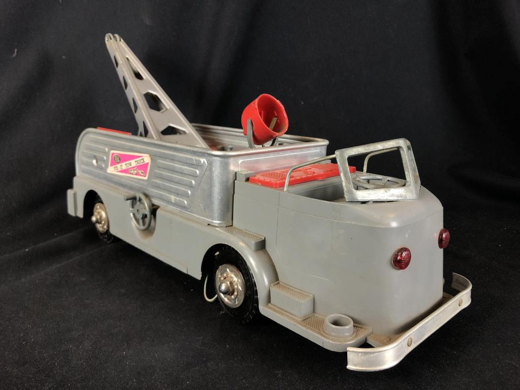 1950's Pressed Steel "Ideal Fix-It" Toy TowTruck: Wonderful 1950's vintage pressed steel die cast toy from the Automobile Play Association, the "Ideal / Fix-It Tow Truck". Die Cast Pressed Steel tow truck with opening compartments, moveable towing me