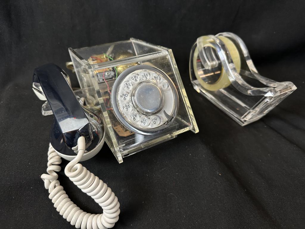 MCM 1970's Lucite Chrome Teleconcepts Phone: Mid Century Modern See through vintage1970's Lucite & chrome Teleconcepts telephone, measures: 9-1/2" l x 7" w x 4-1/2" h. A conversation piece for sure! Includes oversized Lucite tape dispenser with