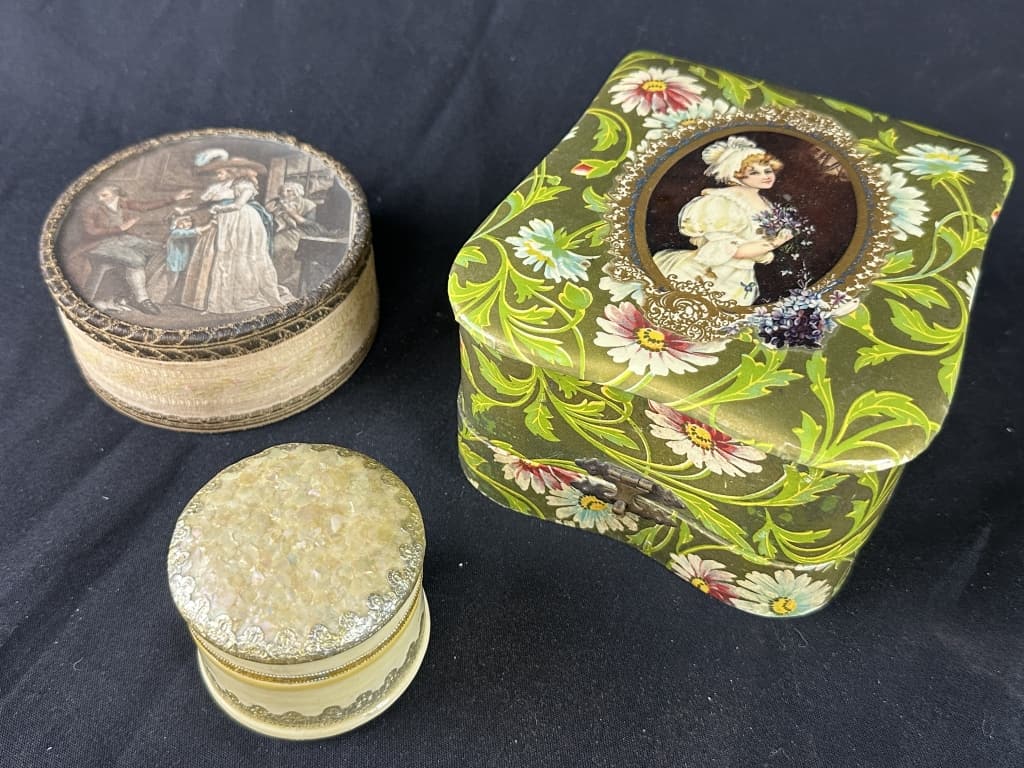 Lot of 3 Decorative Victorian Boxes: Collection of three Victorian lidded trinket boxes containers. 1.) A round Cloth box depicting "The Virtuous Parent" by British painter John Raphael Smith. 4" diameter, 1.75" tall. 2.) Sq. Victorian a