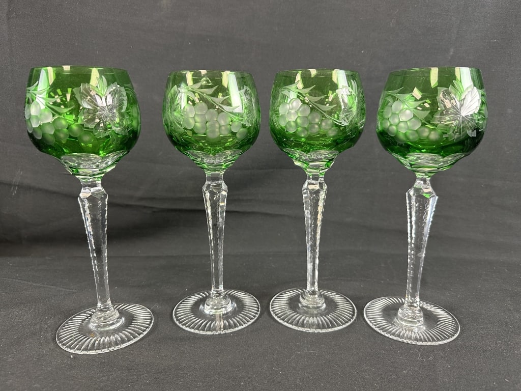 Set of 4 Cut Emerald Green Wine Goblets: Set of 4 Cut White to Emerald Green WIne Goblets. Wheel cut grapes and leaves on green glass goblet, unmarked. Nachtmann Traube? Measures: 8-1/2" tall.