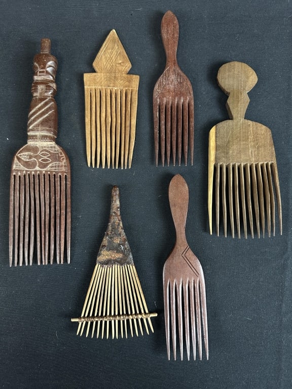 Lot of 6 African Tribal Hand Carved Wood Combs: Lot of 6 African Tribal Hand Carved Wood Combs. Hand carved with primitive geometric shaped handles, dark woods.
