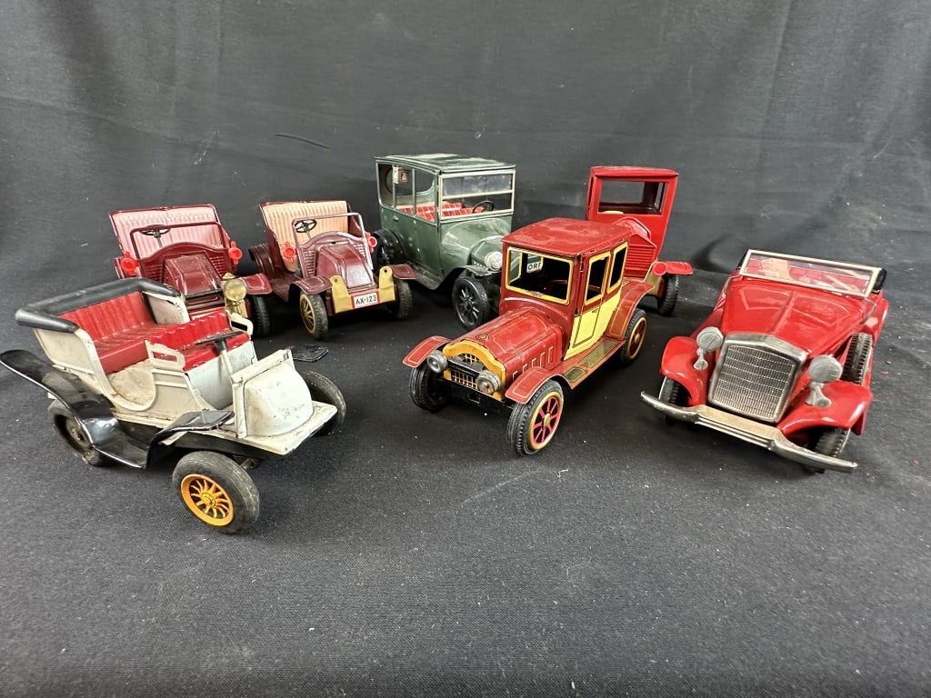 7 Tin Litho Cars Incl, 1915 Ford / 1933 Cadillac: Lot of 7 vintage Tin Litho Cars Including a 1915 Ford, 1933 Cadillac and 5 others! Some marked "Made in Japan" See pics.