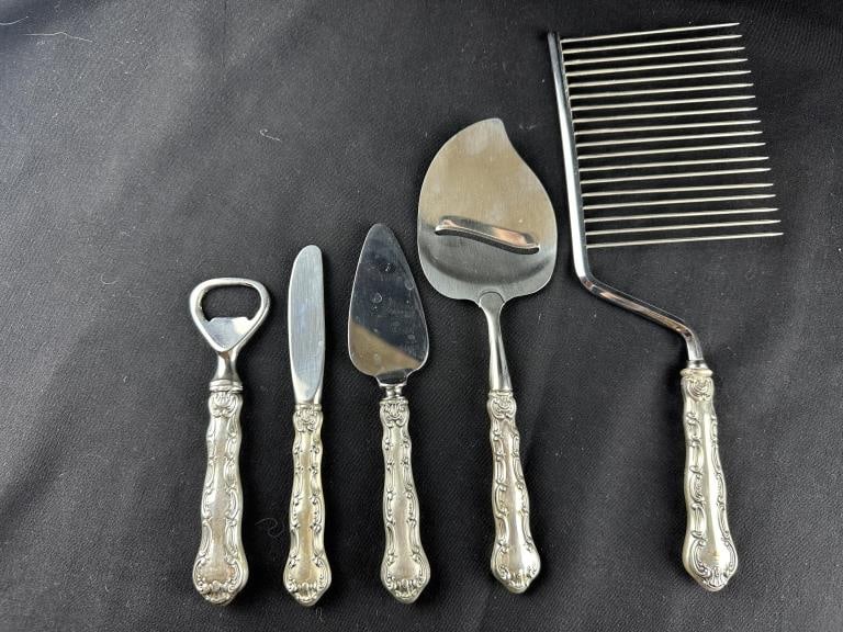 5 Gorham Sterling Handle Strasbourg FlatwarePieces: 5 Gorham Sterling Handle Strasbourg FlatwarePieces Five Sterling Silver handle utensils made by Gorham in Strasbourg pattern. Includes: 1 cheese plane; 1 butter knife; 1 bottle opener; 1 cake breaker;
