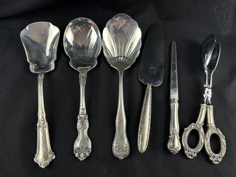 6 Sterling Silver Assorted Flatware Utensils: 6 Sterling Silver Assorted Flatware Utensils Lot of six assorted Sterling Silver flatware utensils. Includes: 1 Gorham large shell spoon; 1 Wallace serving spoon; 1 Gorham serving spoon; 1 Sterling ha