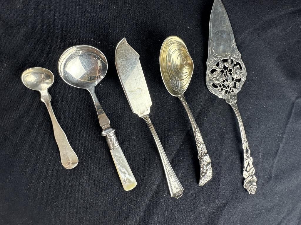 5 Unique Sterling Silver Serving Utensils: 5 Unique Sterling Silver Serving Utensils Lot of five Sterling Silver serving utensils. Includes: 1.) Clamshell spoon, very neat, 6-3/4". 2.) Monogram fish knife, 7". 3.) Rose motif pierced pie server