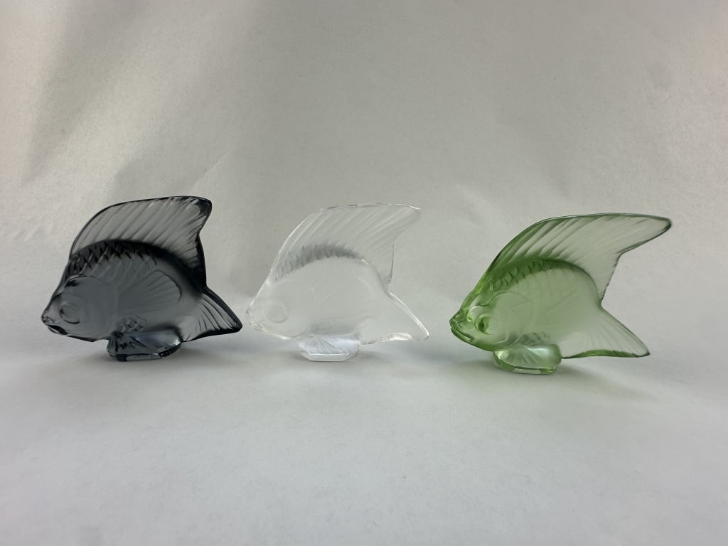 3 Lalique Cut Crystal Iconic Fish Light Tones: 3 Lalique Cut Crystal Iconic Fish Light Tones Set of three iconic crystal Lalique fish in Light Opaque tones of clear, spring green, and smoky grey. Measures: 2" x 2".