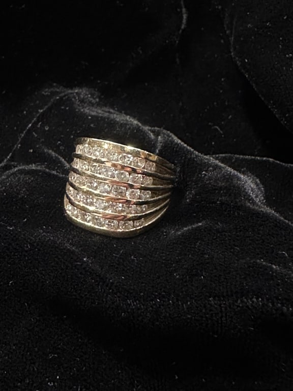 Impressive Five-Row Diamond 14K Statement Ring: Impressive Five-Row Diamond 14K Statement Ring This bold and luxurious five-row diamond band is crafted in rich 14K yellow gold. The ring features 5 rows of Seven 10 point round-cut diamonds approx. s