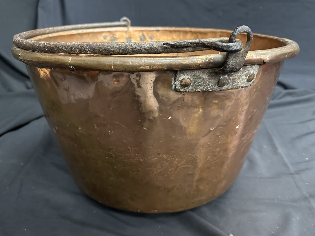 Large Antique Copper Cauldron Kettle w/ Handle: Large Antique Copper Cauldron Kettle w/ Handle Antique large handmade copper cauldron kettle with hand forged Wrought Iron handle attached by rivets. Hung over a fire, often to make apple butter. Meas