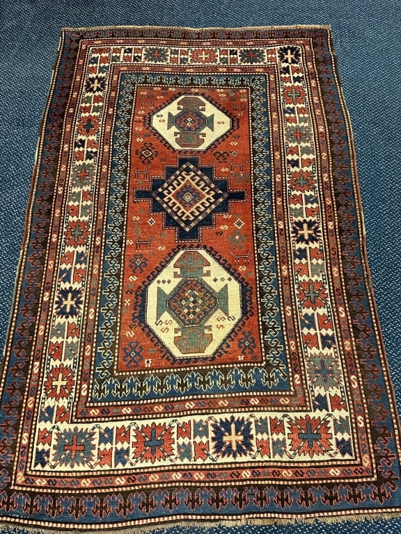 19th C. Kazak - Karbaugh Handmade Oriental Carpet: 19th C. Kazak - Karbaugh Handmade Oriental Carpet with Animals. Weave on back is exceptional. Measures: 58" x 97" plus 2" of fringe. Includes a rod pocket on reverse.