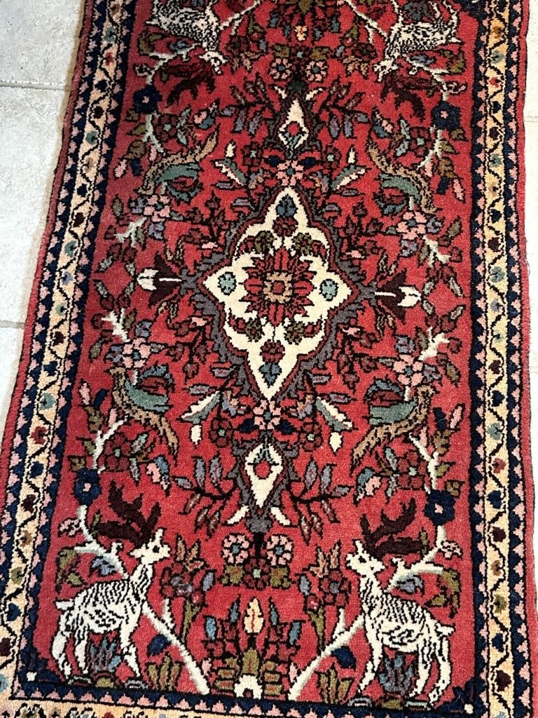 Sm Handwoven Oriental Stag & Bird Rug 23" x 39.5": Sm Handwoven Oriental Stag & Bird Rug 23" x 39.5" Oriental Semi Antique rug carpet with vibrant geometric designs featuring stags and birds.Center mediallion. Measures: 23" x 39-1/2", 40-1/2" with fri