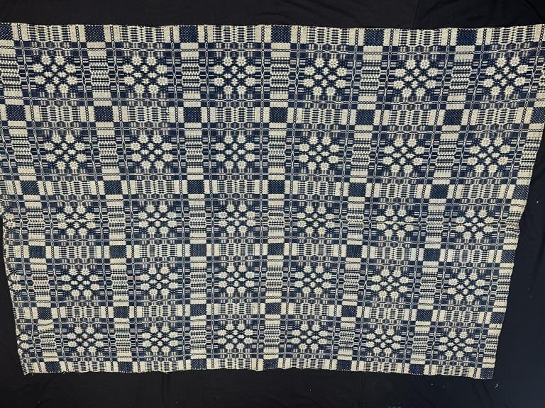 Antique Blue and White Handwoven Coverlet: Antique Blue and White Handwoven Coverlet Antique hand woven blue and white coverlet. Measures: 65-1/2" x 93". This antique handwoven coverlet featuring a classic blue and white pattern. The intricate