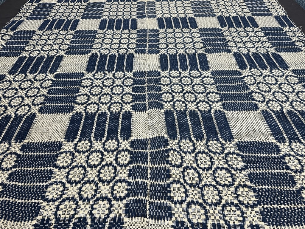 Blue and White Antique Handwoven Coverlet: Blue and White Antique Handwoven Coverlet Handwoven Antique blue and white coverlet. Measures: 100" x 69". This antique handwoven coverlet featuring a classic blue and white pattern. The intricate des