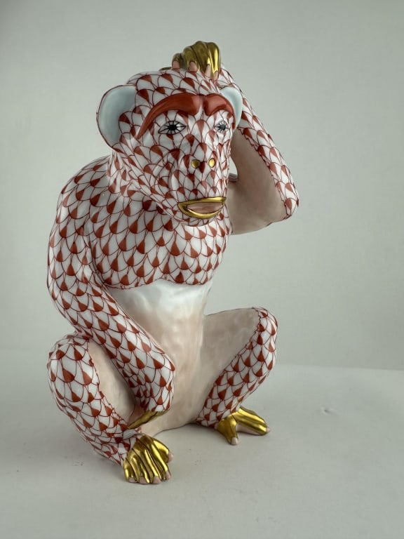 Herend Chimpanzee Red Porcelain Fishnet 15619: Herend Chimpanzee Red Porcelain Fishnet 15619 Herend seated chimpanzee in red (VH) fishnet pattern with 24k gold accents. Handpainted porcelain Made by Herend of Hungary. Marked "15619-0-00 SVH B99 72