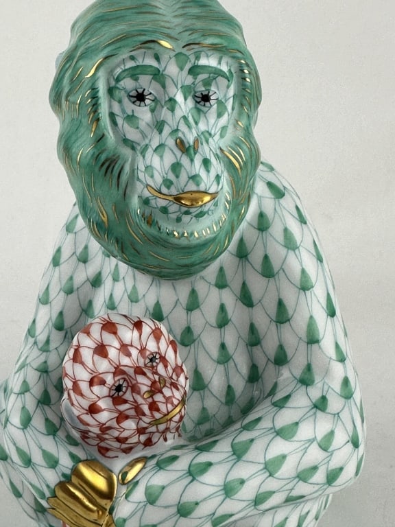 Herend Monkey Mother Green & Red Fishnet 15657: Herend Monkey Mother Green & Red Fishnet 15657 Herend mother monkey holding baby in red (VH) and green (VHV) fishnet pattern with 24k gold accents. Made by Herend of Hungary. Marked "15657 Handpainted