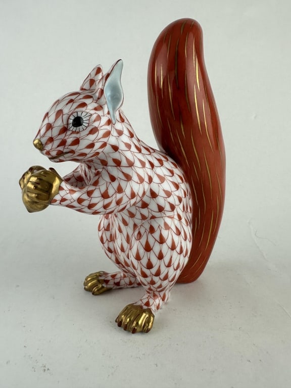 Herend Squirrel w Nut Red Porcelain 15388: Herend Squirrel w Nut Red Porcelain 15388 Handpainted Herend porcelain squirrel with acorn in red (VH) fishnet pattern and 24k gold accents. Made by Herend of Hungary. Marked "15388 VH F 94 46". Measu