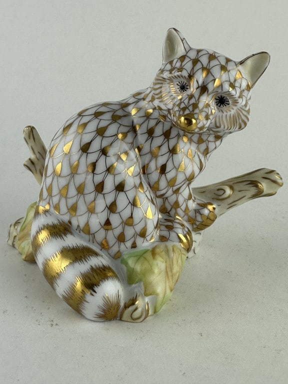 Herend Guild Raccoon Gold Porcelain 15854: Herend Guild Raccoon Gold Porcelain 15854 Handpainted Herend porcelain raccoon on branch in 24k gold (VHOR) fishnet pattern with natural accents. Made by Herend Guild of Hungary as the 2004 annual fig
