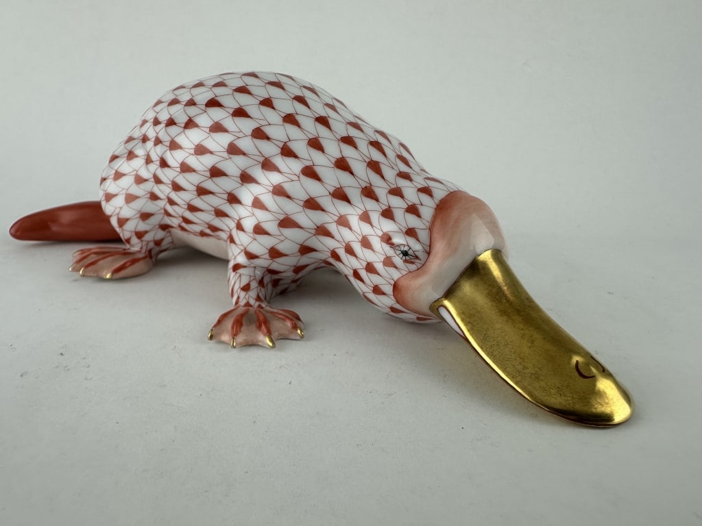 Herend Platypus Red Porcelain 15420: Herend Platypus Red Porcelain 15420 Handpainted Herend porcelain duckbill platypus in red (VH) fishnet pattern with 24k gold accents. Made by Herend of Hungary. Marked "15420-0-00 SVH F2001 235". Meas