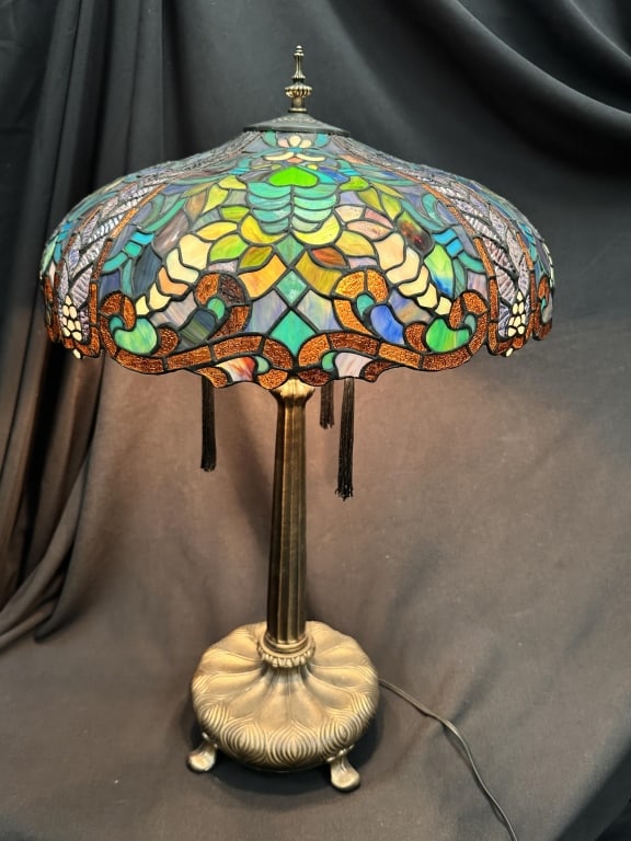 Tiffany Art Nouveau Style Stained Glass Table Lamp: Wonderful Colorful Tiffany Art Nouveau style copperfoil stained glass table lamp with blue toned swirling geometric shade with amber accents on footed base. Three bulbs top the fluted column body. Mea