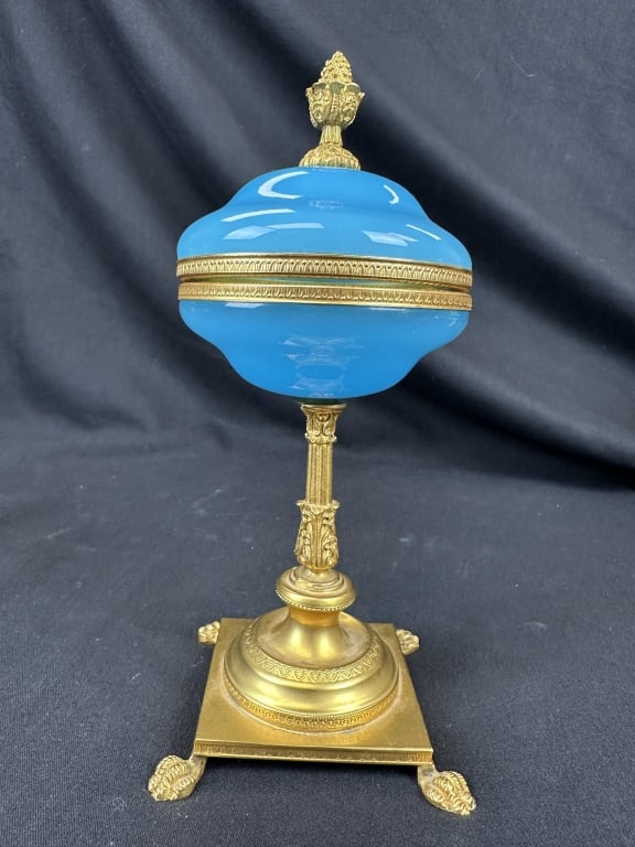 Rare French Blue Opaline Brass Ormolu LiddedVessel: An exquisite antique French blue opaline glass lidded vessel, featuring ormolu banded fittings and an acorn finial. The piece is supported by an ornate pedestal, with a gilted column and square socle