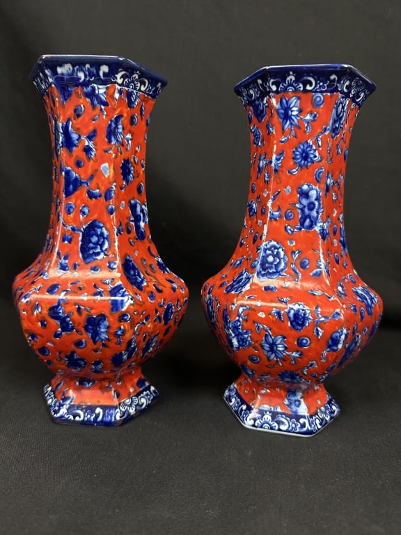 Staffordshire Porcelain Hexagonal Floral Vase Pair: A pair of antique Staffordshire Porcelain hexagonal vases dated to c.1840, featuring a transfer printed cobalt blue floral design pattern with a brilliant red ground color. The bottom of one of the va