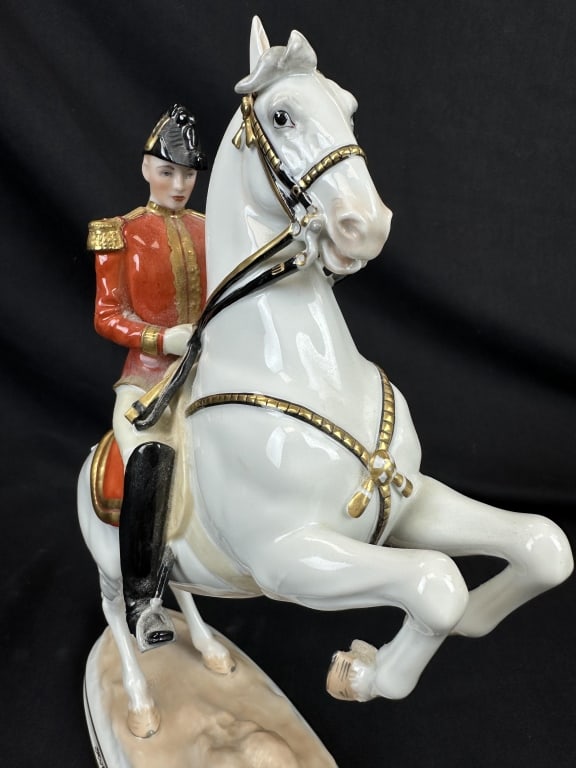 Augarten Royal Vienna Porcelain Lipizzaner Horse: A Royal Vienna Porcelain horse rider figure made by Augarten, depicting a Lipizzaner horse in classical dressage from the Spanish Riding School. One side of the base reads "Hofburg Wien" for the forme