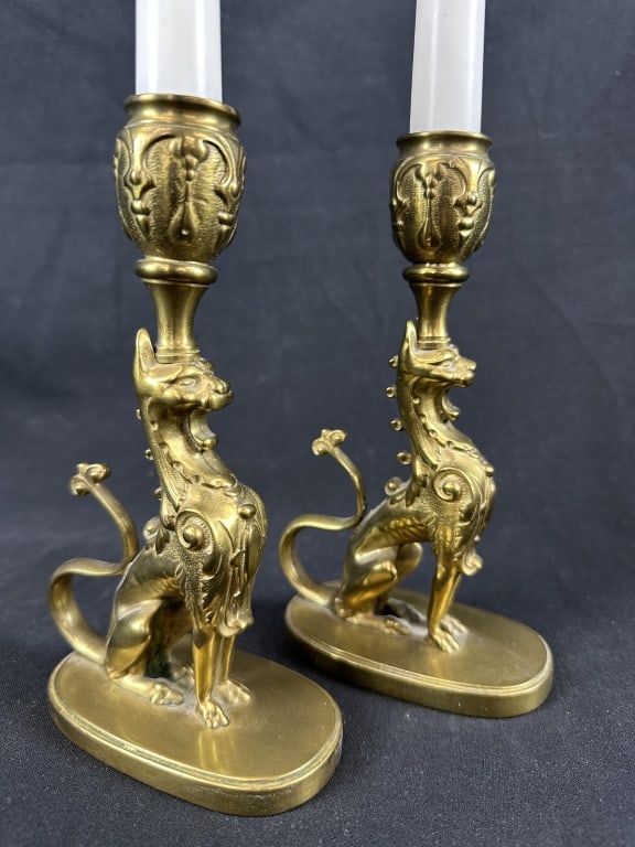French Gilt Bronze Pr Griffin Candlestick Holders: A vintage pair of French candlestick holders featuring gilt griffin figures. Measures: 7" H x 4-1/4" W x 2-1/4" D.