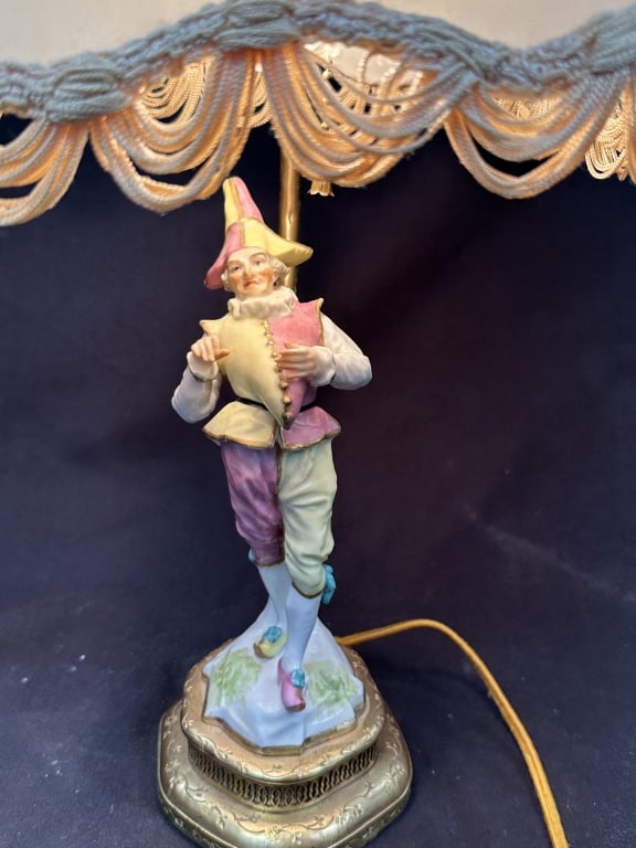 Jester Commedia dell"Arte Porcelain Accent Lamp: Handpainted porcelain figurine of jester / harlequin on ornate brass base delicate accent table lamp. Commedia dell'Arte figure in excellent condition with gilt accents. Measurements: Body: 9-3/4" H x