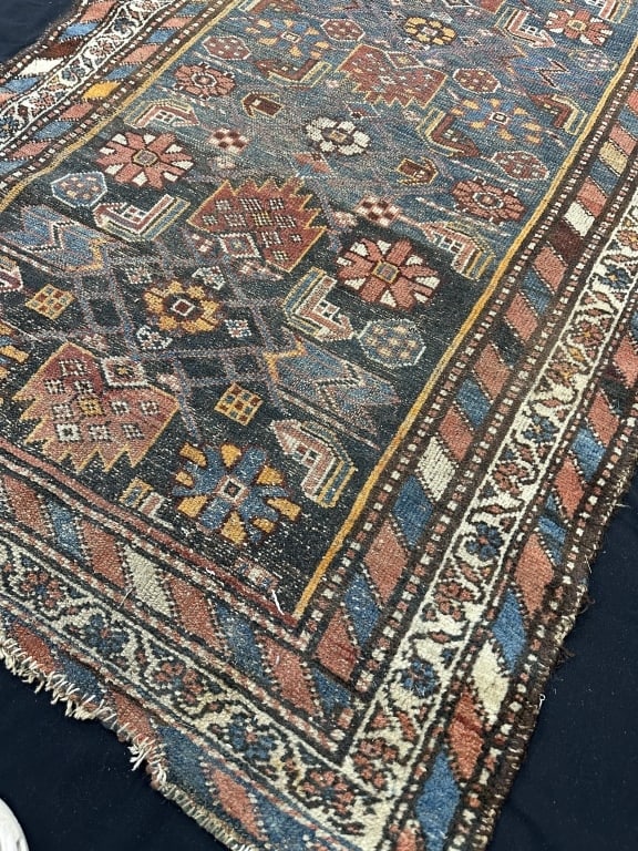 Antique Hand Knotted Caucasian Area Rug 42" x 63": Antique Hand Knotted Caucasian Area Rug - Colorful Patterns Border Color: cream dominant with stripes of red, blue, burgundy, gold, black, & cream Field Color: dominant colors are shades of blue