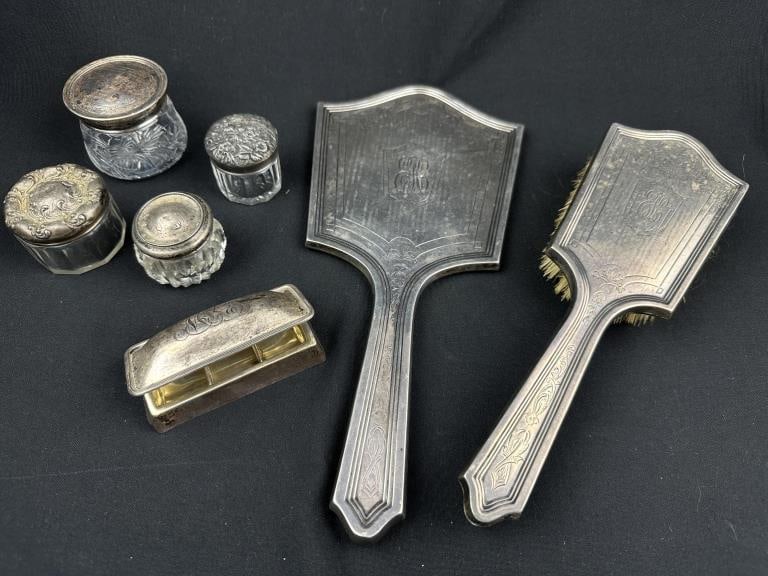 Sterling Vanity Set w Brush, Mirror,Crystal Jars &: A refined antique vanity ensemble of 7 items, comprising a sterling silver-mounted brush and mirror set accompanied by a sterling stamp box and an assortment of crystal jars with sterling lids, all re