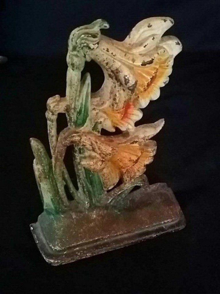 Vintage Painted Iron Doorstop of Lillies: Vintage Painted Iron Doorstop of Lillies, Remains in good original condition with scattered paint loss. Measures 7 3/4" tall.
