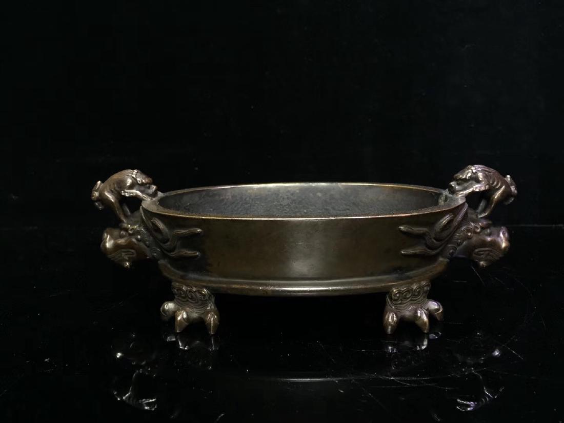 Bronze Double Dragon Handle Censer with Mark: Bronze Double Dragon handle Censer Has four dragon claw feet on bottom has Mark on bottom 20 x 10.5 x 6.5 cm Weight: 1206.8 grams.