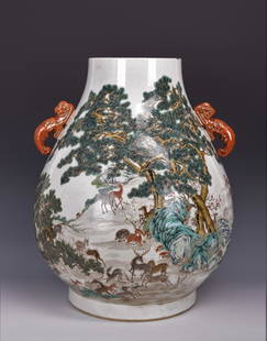 Famille Rose 'Hundred Deer' Porcelain Vase with Mark: LARGE FAMILLE ROSE 'HUNDRED DEER' PORCELAIN VASE WITH MARK, Hu-shape with a continuous scene of one hundred deer in a mountain range with pines and rocks, a pair of dragon-form loop handles in iron-re