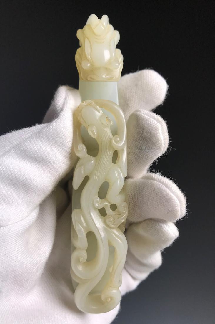 A WHITE JADE 'DRAGON' BELT HOOK, 18/19TH CENTURY (1 of 11)