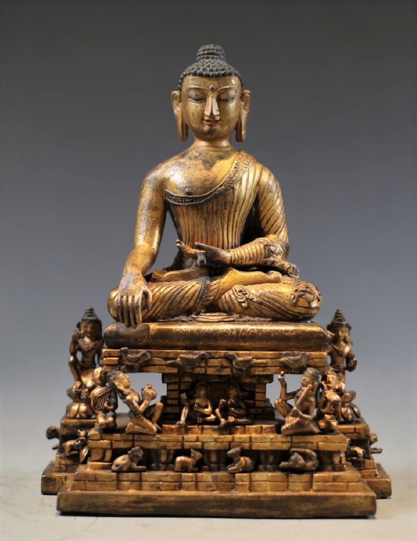 A GILT-BRONZE STATUE OF SEATED SAKYAMUNI (1 of 11)