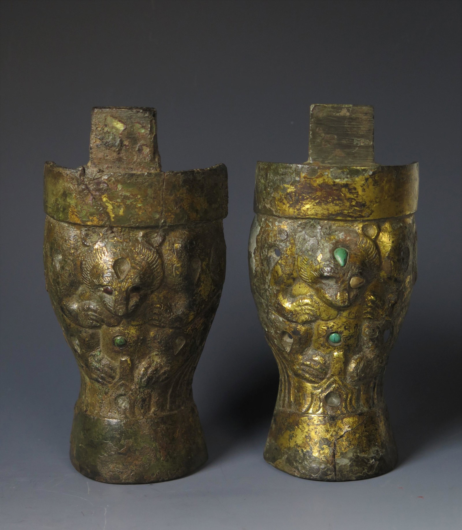 RARE INLAID & GILDED BRONZE LEG, HAN DYNASTY, TESTED: RARE PAIR OF INLAID & GILDED BRONZE LEG, HAN DYNASTY, TESTED A highly unusual pair of inlaid and gilded bronze fittings.Bears, such as these, were a popular subject in art of the Han dynasty. This pai