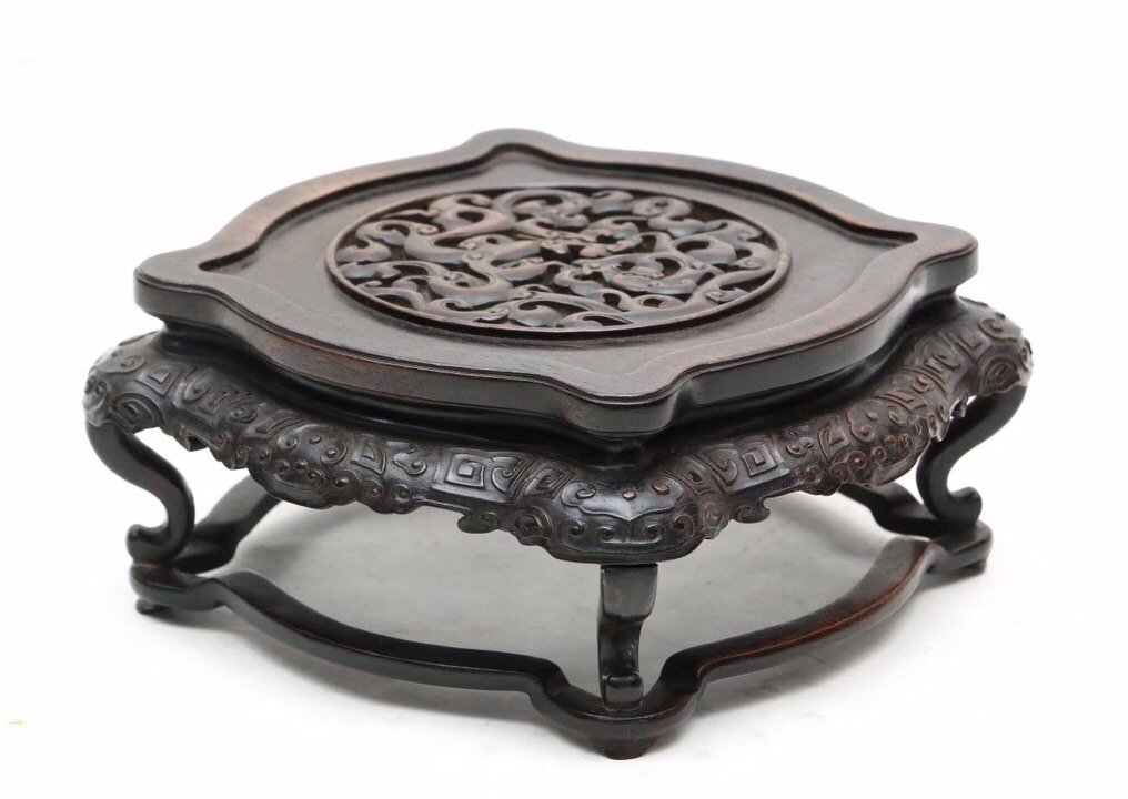 Carved And Pierced Zitan Wood Stand: CARVED AND PIERCED ZITAN WOOD STAND Dimension: 3 3/8" H x 7 1/16" W (8.5 x 18cm). A LIST OF RECOMMENDED THIRD-PARTY SHIPPER IS AVAILABLE UNDER SHIPPING INFORMATION. PLEASE FEEL FREE TO CONTACT THEM FO