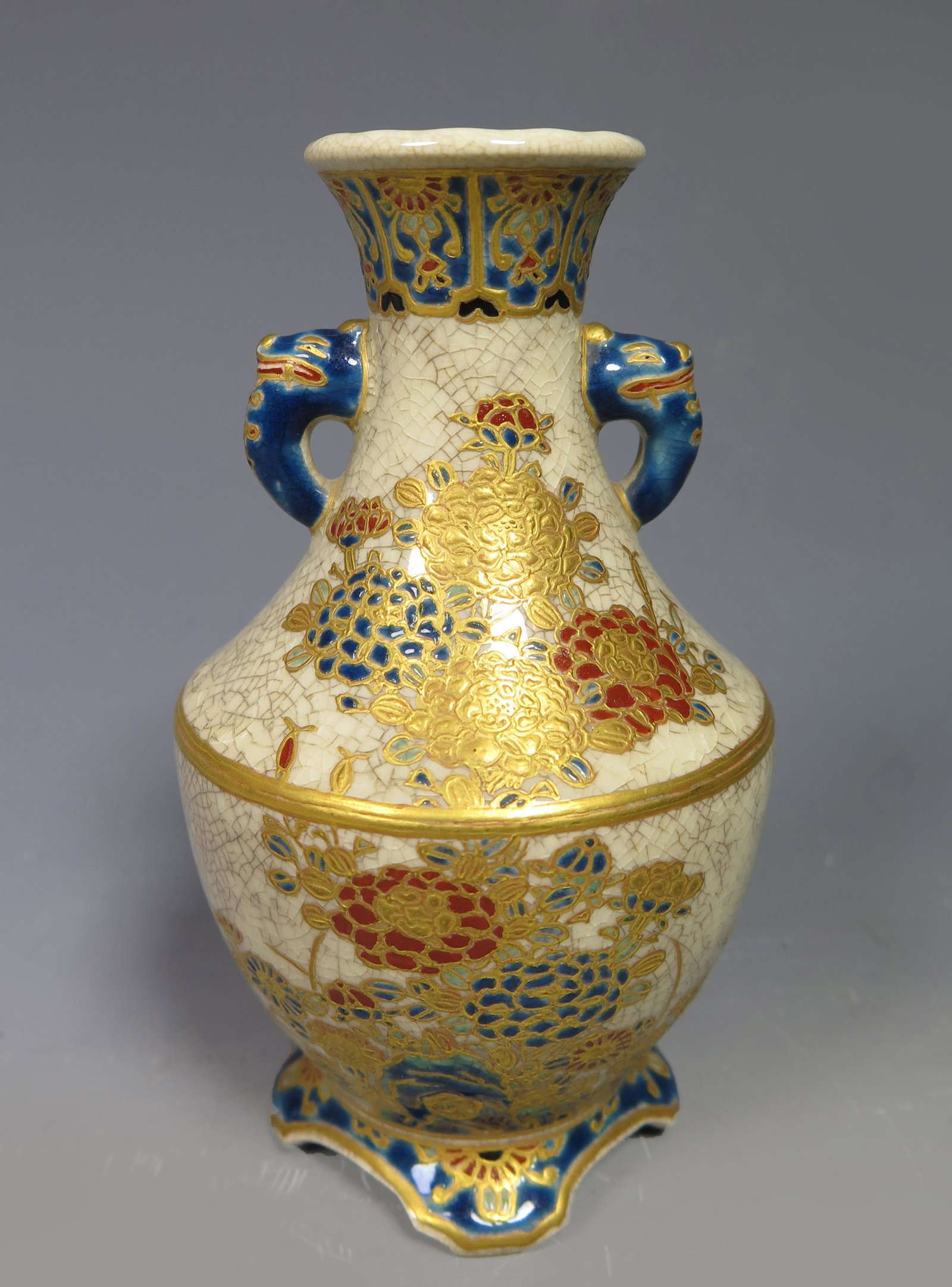 Japanese Meiji Period Imperial Satsuma Vase, Marked: JAPANESE MEIJI PERIOD IMPERIAL SATSUMA VASE, with 'Gossu' blue elephant mask head handles and floral motif overall, artist signature on bottom. Dimension: 4 3/4" (12cm) H. A LIST OF RECOMMENDED THIRD-