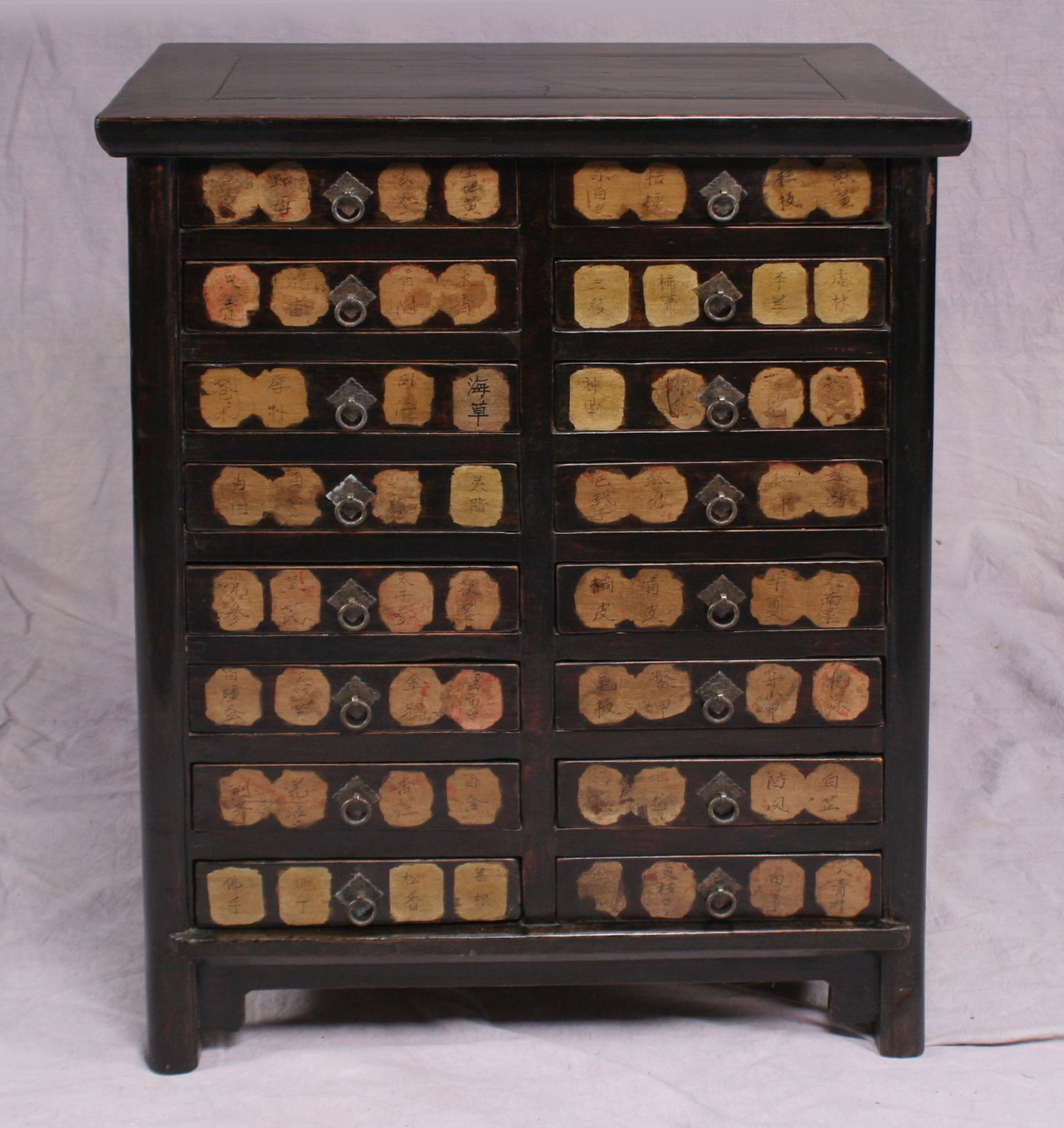 Very good Chinese apothacary, 19th c.: A substantial Chinese pharmaceutical cabinet with 16 drawers and dividers, herb or content. names on drawers. Fine finish and structurally sound. 19th century. Dimension:36 1/4" high x 28 1/2" wide x 