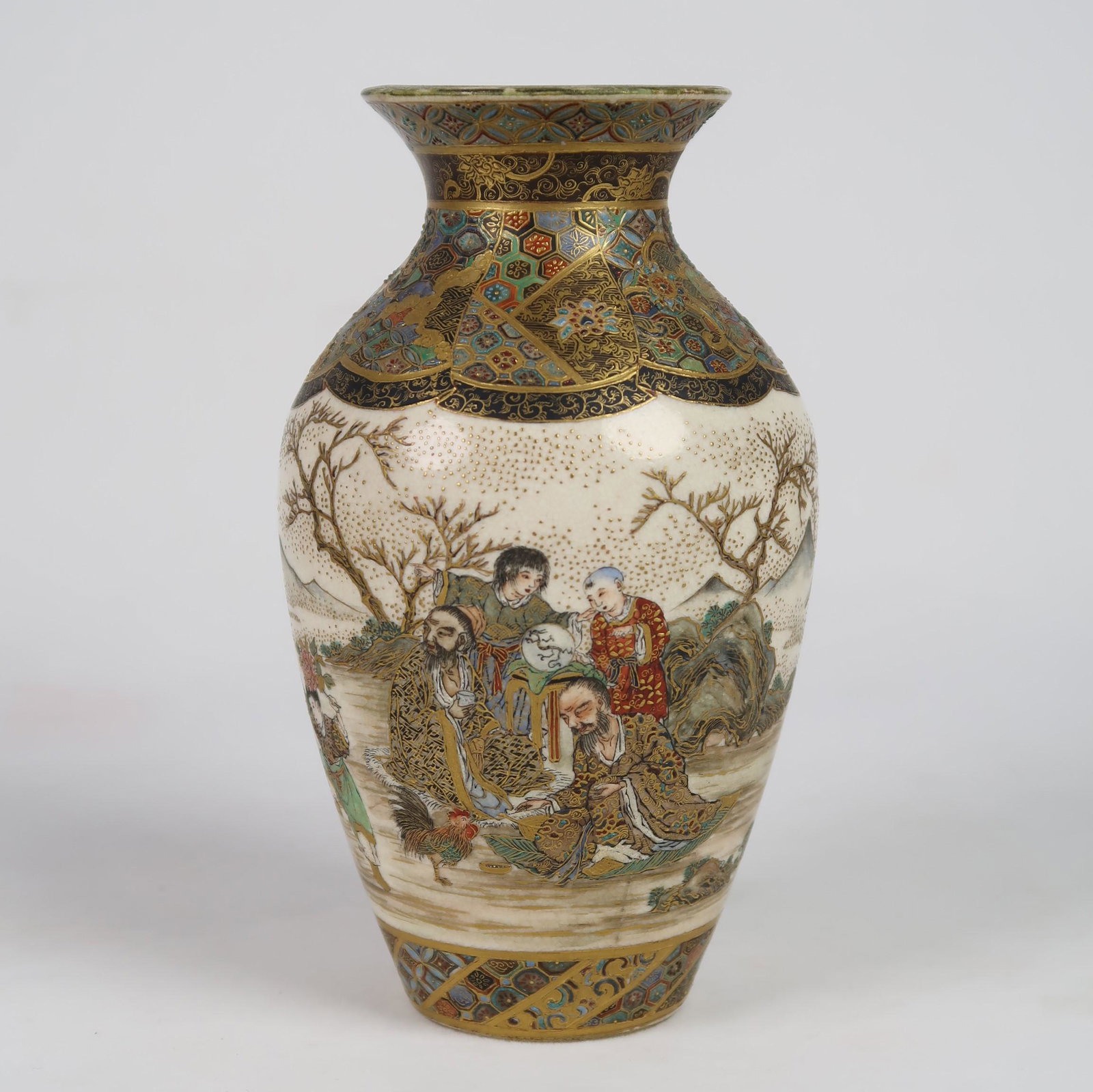 A finely enameled and drawn Satsuma ovoid shaped vase: Decorated in enamels and gilt, with outdoor family scenes around central body, geometric patterns on shoulder, neck and base. Unsigned. Ex Kohut Collection #129. Meiji Period c. 1868-1912 Dimension: 5