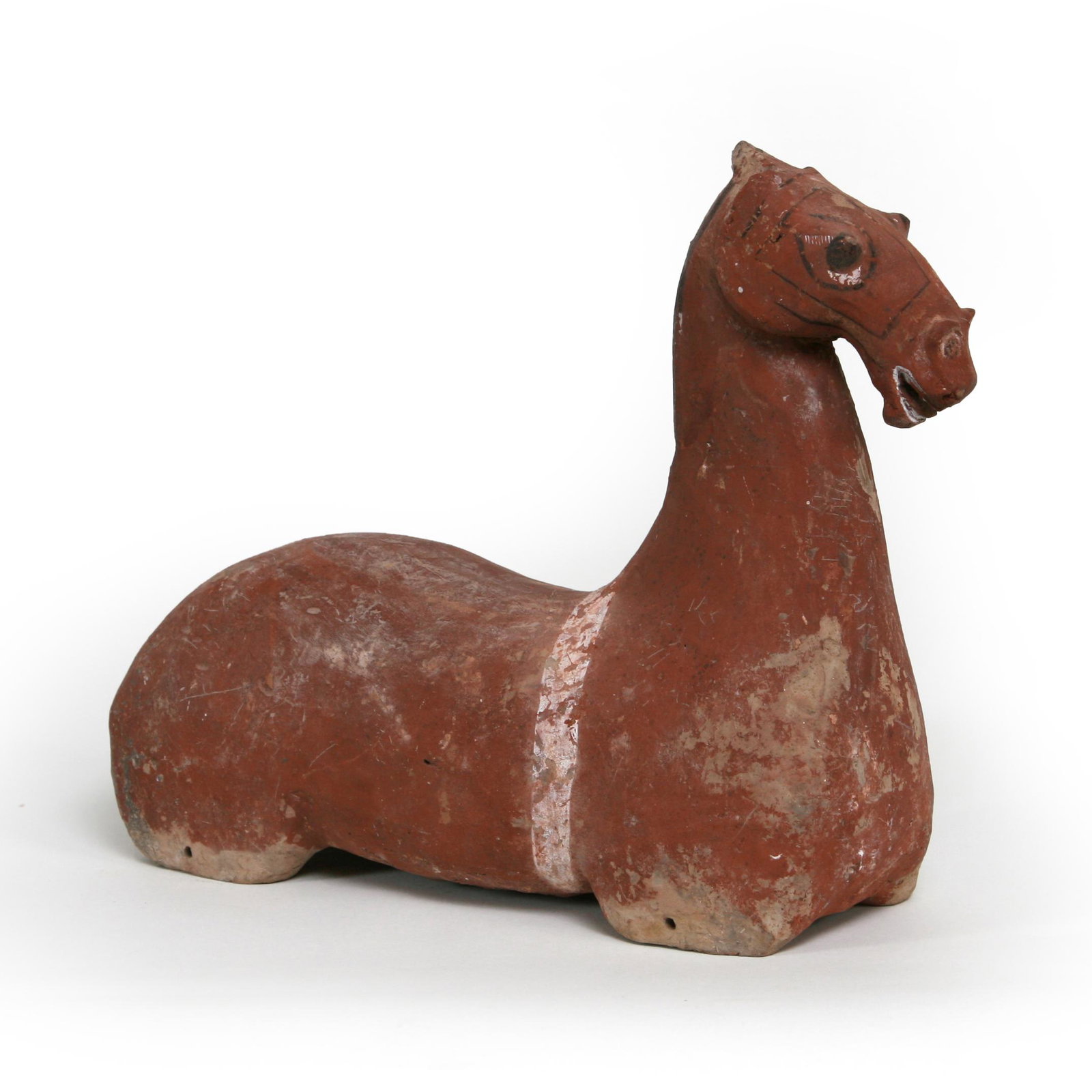 Han Dyn. Painted Recumbent Horse, Of The Peroid: A classic Han Dynasty recumbent horse (of the period). This charming, finely original pigmented recumbent horse is in excellent original condition. The shape of the head, mouth and body tell us that i