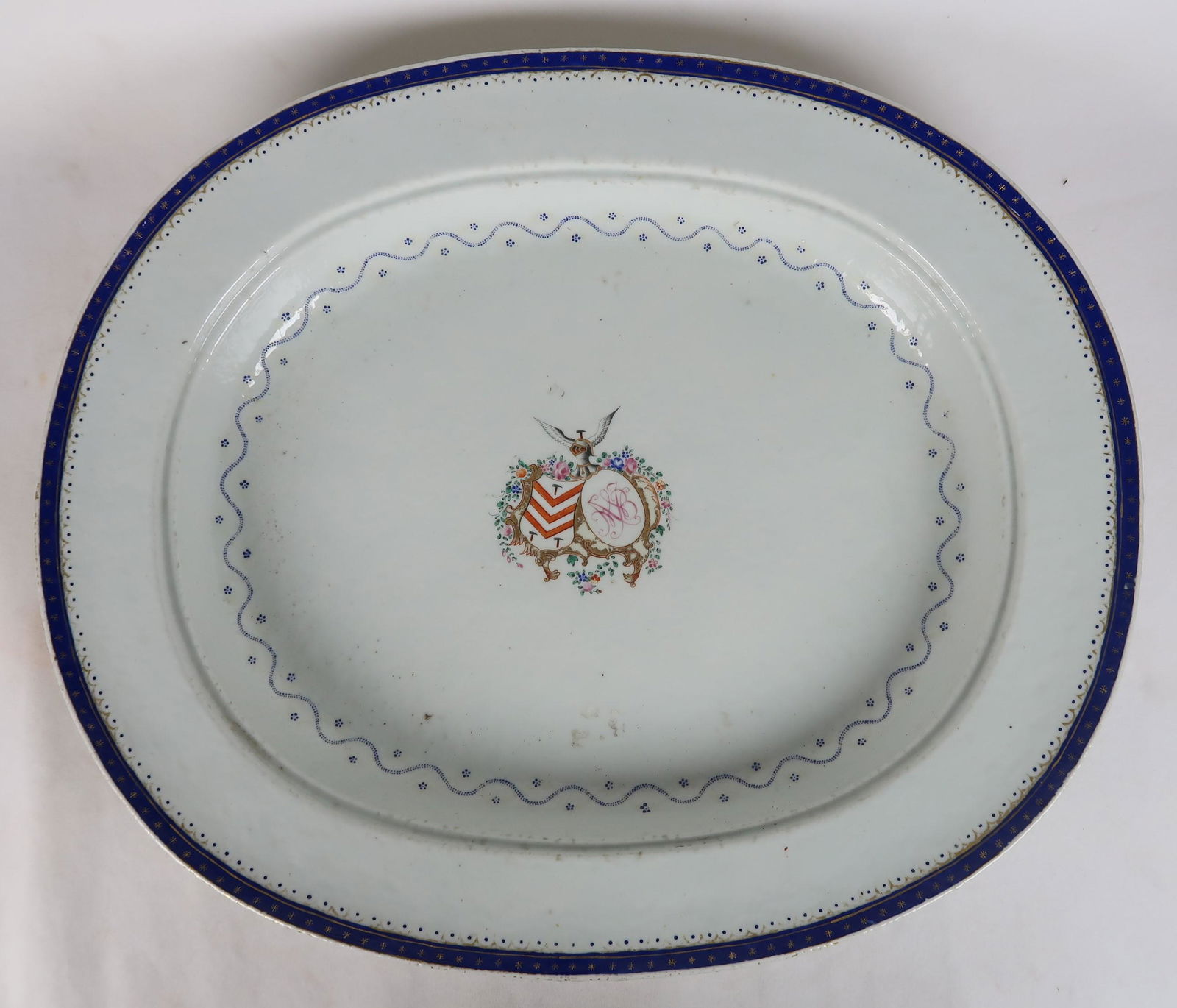 Very Large Chinese Export Dish, 18th Century: Very Large Chinese Export Dish, 18th Century. This deep serving platter was probably made to serve dishes and meats that had a lot of sauce or juices. Fine armorial piece with excellent workmanship. 1