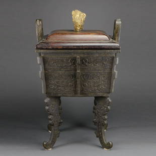 Large Bronze Archaic Style Fang Ding Censer: Description Large Bronze Archaic Style Fang Ding Censer.Archaic style bronze fang ding censer with loop handles, raised flanges and curved, stylized dragon legs. Decorated with low relief taotie mask